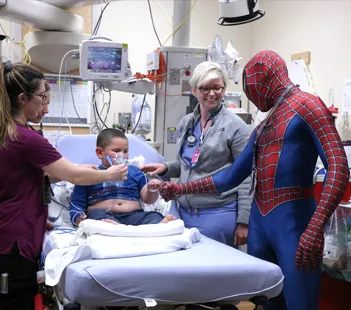Superheroes Visit Patients for National Superhero Day